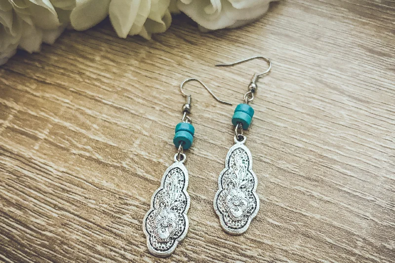 Hoop earrings with gold accents for a warm, elegant statement piece-Bohemian Carved Silver and Turquoise Flower Earrings