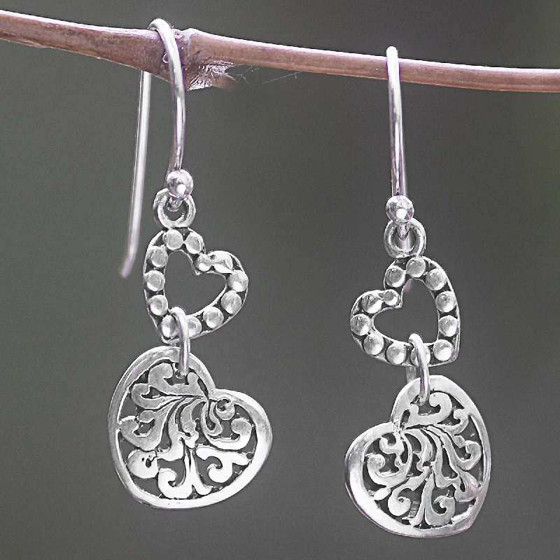 Hoop earrings with twisted metal designs for a dynamic and modern style-Dangling Hearts Sterling Silver Earrings