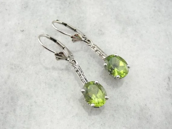 Hoop earrings with dangling charms for a playful and fun look-Peridot and White Gold Art Deco Earrings