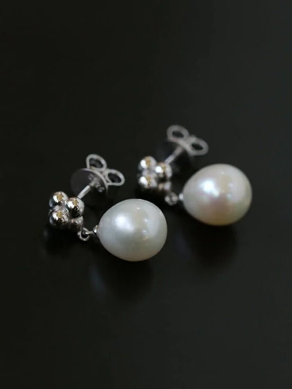 Hoop earrings with snake print designs for an edgy, wild appearance-Elegant Sterling Silver Pearl Earrings