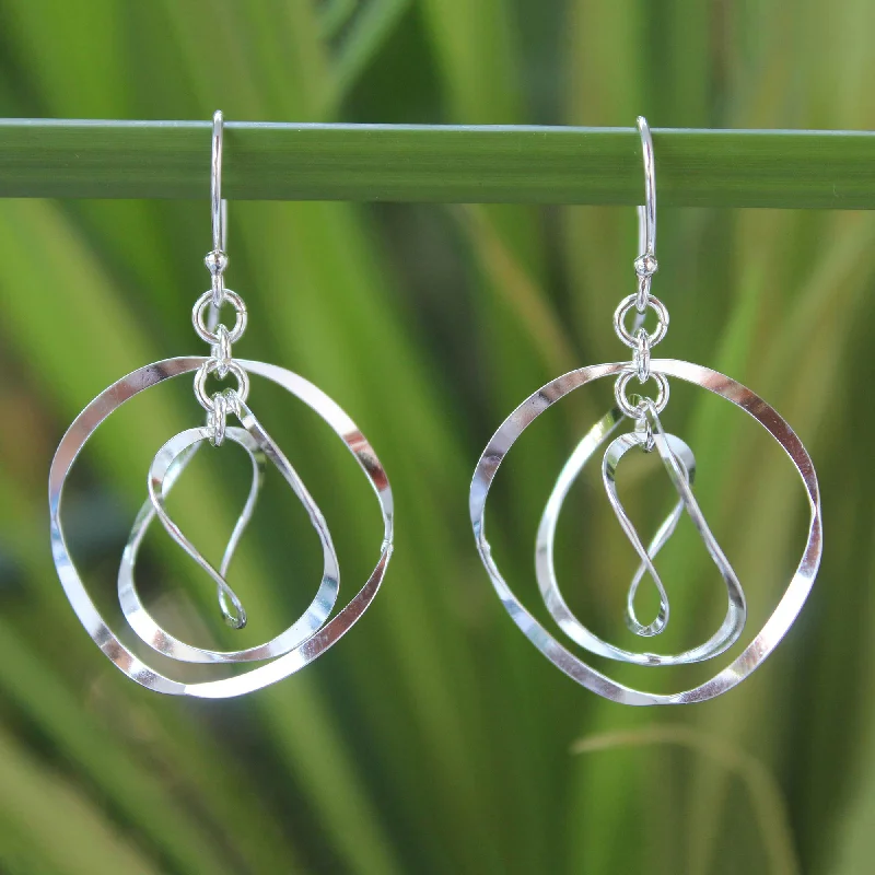 Hoop earrings with stacked layers for a bold and textured design-Twirling Silver Circular Dangle Earrings