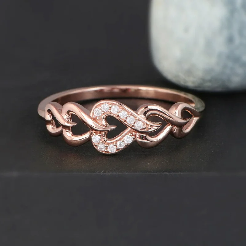 Engagement rings with carved moonstone band patterns -De Couer 10k Rose Gold 1/20ct TDW Diamond Fashion Ring - Pink