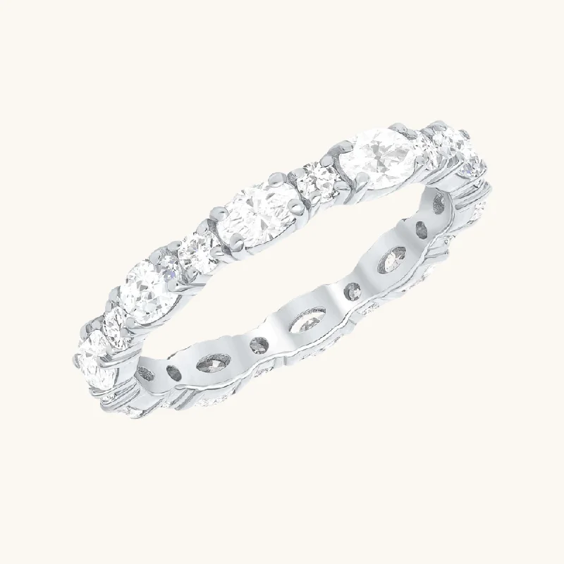 Engagement rings with vine-inspired topaz bands -Oval + Round Diamond Eternity Band